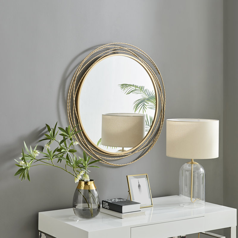 Rowden layered metal frame round mirror with a modern statement design