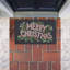 Tapis d'entrée Merry Christmas avec feuillage, design par Heather McLaughlin, 18 po x 30 po
