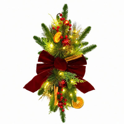 Guirlande lumineuse artificielle de Noël en forme de larme de 60 cm (23,6 pouces) avec nœud en velours rouge, quartiers d'orange, baies rouges et boules de Noël. Décoration murale ou de porte lumineuse pour les fêtes.