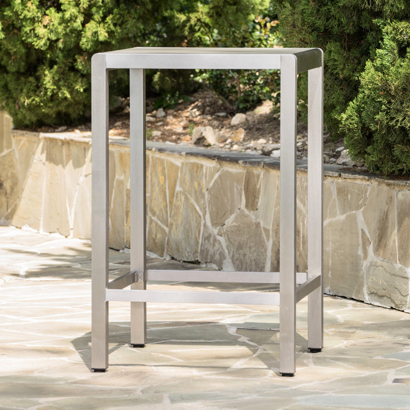 Table de bar d'extérieur grise avec structure en aluminium et plateau en verre givré, légère et résistante aux chocs.