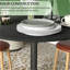 Table de salle à manger de 89 cm (35 po) au design ajustable, noire, avec rallonge rabattable et finitions en bois massif.