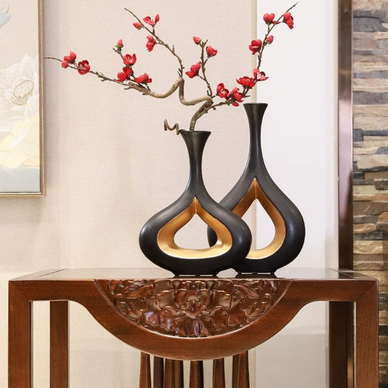 2 pièces de vases à beignes noirs et dorés 
