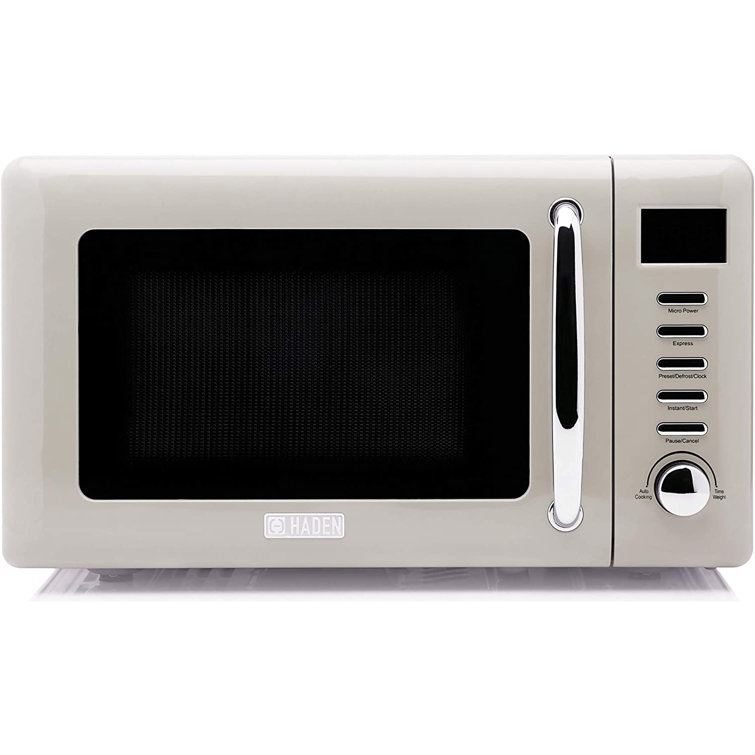 Highland 0.7-cu ft 700-Watt Countertop Microwave (Cream) in the Countertop  Microwaves department at