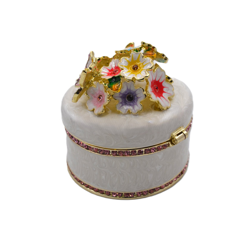 Boîte à bijoux ronde avec fleurs et papillons