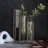 Elegant Oversized Pedestal Beaker Vase with Clear Glass and Gold-Finished Metal Frame for Modern Interiors