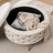 Cristen Upholstered Round Storage Ottoman-1053577179