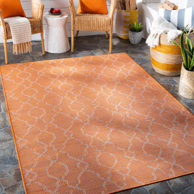 Tapis orange à motif géométrique Brimberry