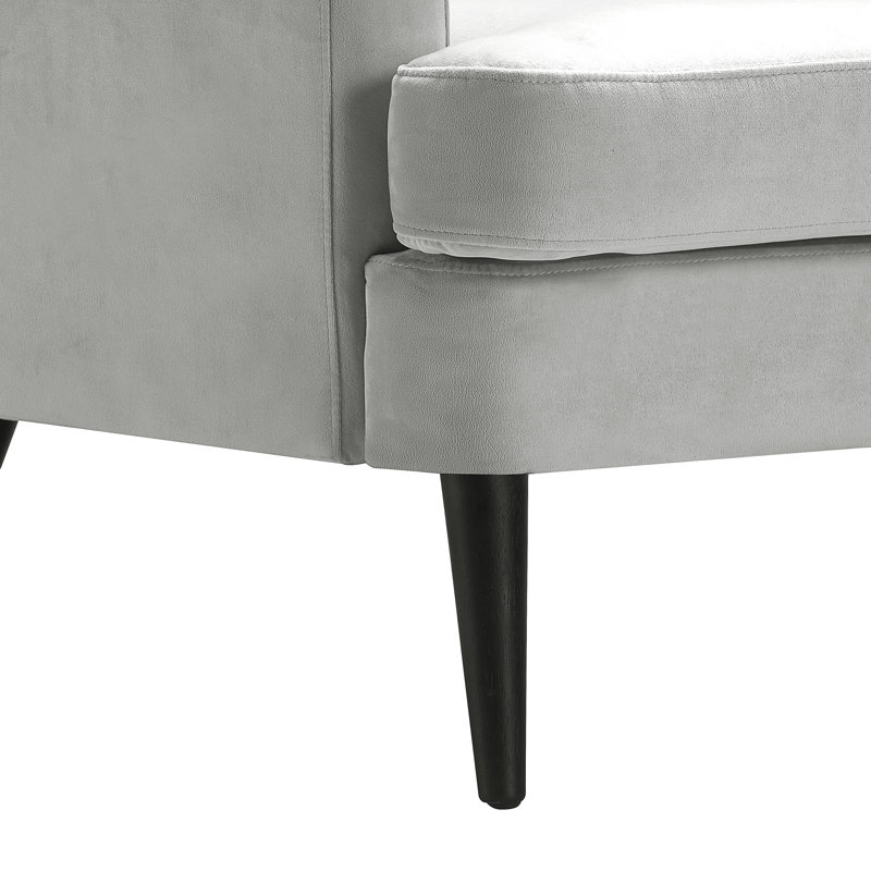 Fauteuil d'appoint Elle Decor Celeste 81 cm de large en velours capitonné, fauteuil à oreilles avec dossier capitonné, accoudoirs hauts et design vintage classique
