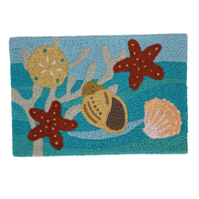  Coquillage sur des vagues bleues