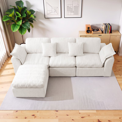 Canapé d'angle modulaire infonuagique avec pouf amovible, canapé moderne 4 places en forme de L avec assise profonde, idéal pour le salon, la chambre ou un appartement.