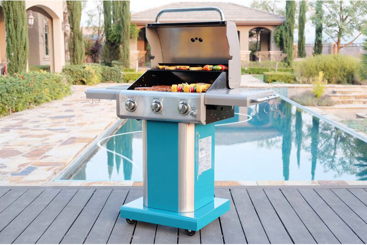 blue gas grill in front of pool