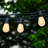 Ambience Pro 27 ft. Solar Outdoor Patio LED String Lights with 12 Warm White Flame-Effect S14 Bulbs, Weatherproof