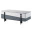 Table basse moderne grise et blanche avec plateau de rangement organisé avec fonction de levage