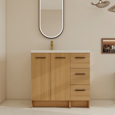 Ensemble de meuble-lavabo simple sur pied 36 po avec lavabo supérieur en résine gauche et plancher avec porte à fermeture en douceur et tiroirs