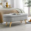 Élégant banc de rangement ovale avec pieds en bois d'hévéa pour sièges supplémentaires et tissu de rangement caché.-511003804