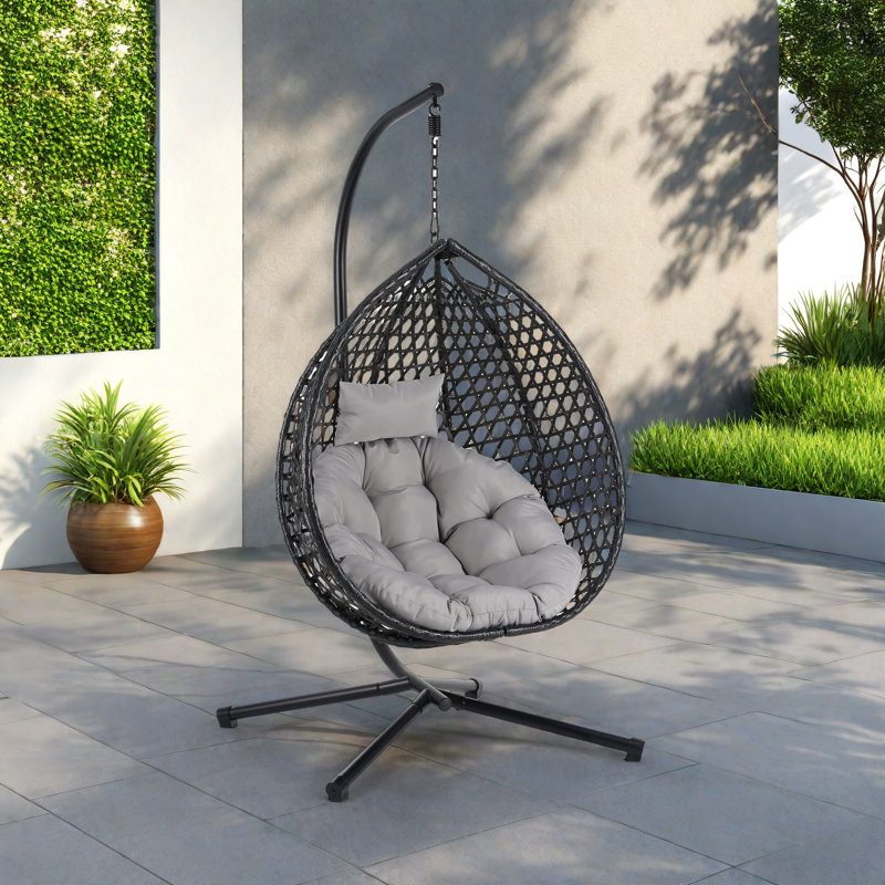 Fauteuil à œufs suspendu polyvalent avec motif en rotin évidé Pe, base en fer, appui-tête et coussin