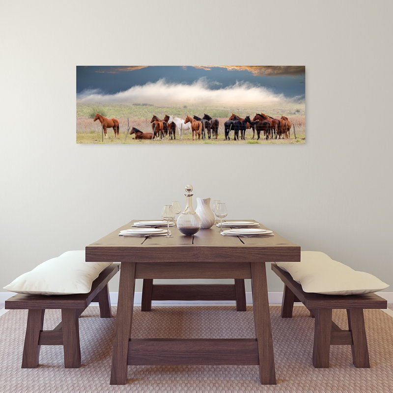 Horses Under Dramatic Sky by Chechi Peinado - Wrapped Canvas Panoramic Print, 40.64 cm H x 121.92 cm W