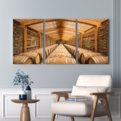 Ensemble de 3 tableaux sur toile tendue représentant une cave à vin en bois.