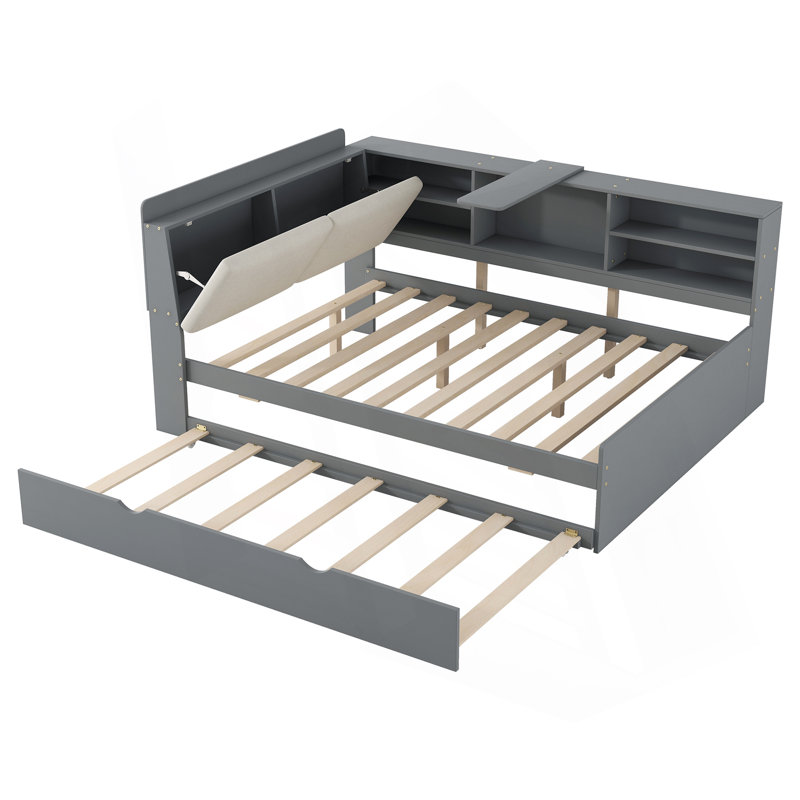 Lit plateforme en bois avec lit gigogne, tablettes et tête de lit en bois