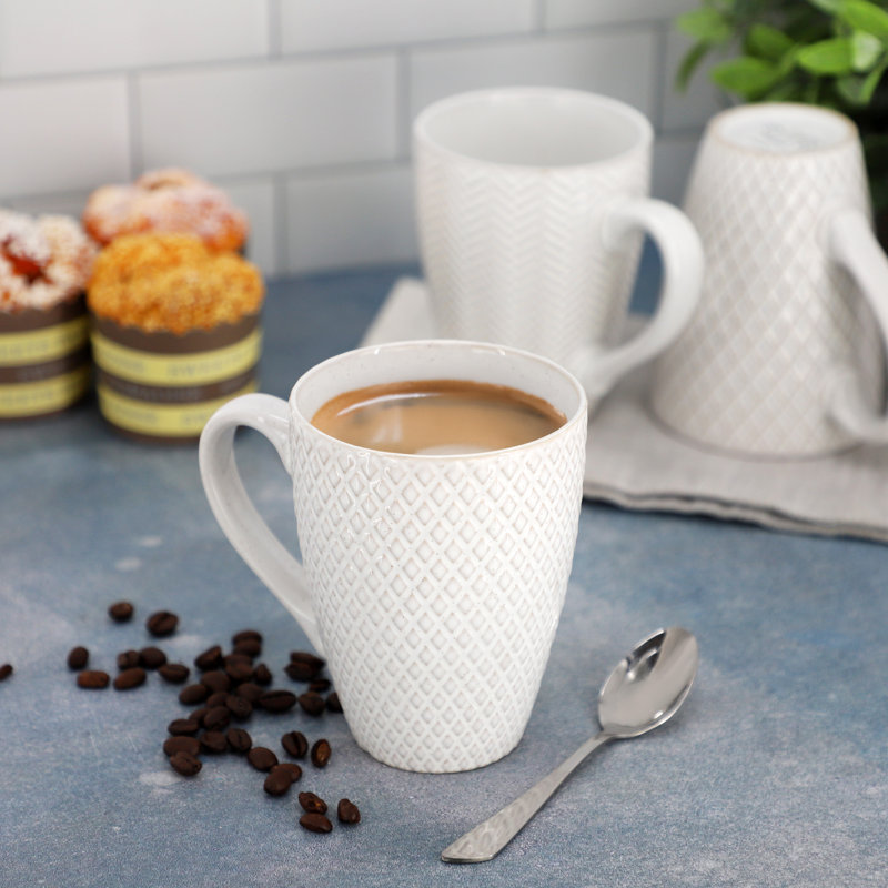 Gibson Elite Earlhart 4 Piece 16 Ounce Stoneware Assorted Pattern Mug Set in White