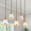 Suspension moderne à 5 lumières Kennesaw, à intensité variable, avec cône linéaire blanc et or, idéale pour îlot de cuisine.