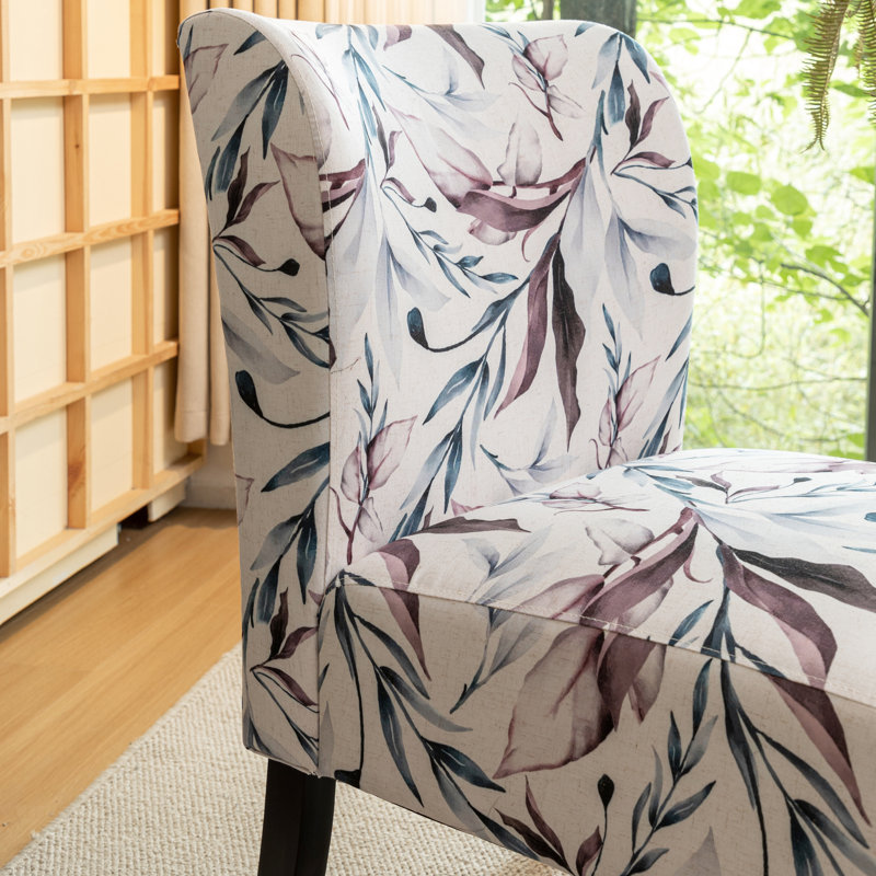 Fauteuil en tissu imprimé avec motif floral mauve - Espace de vie moderne, assise confortable et sans accoudoirs