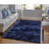 Tapis bleu foncé touffeté à la main