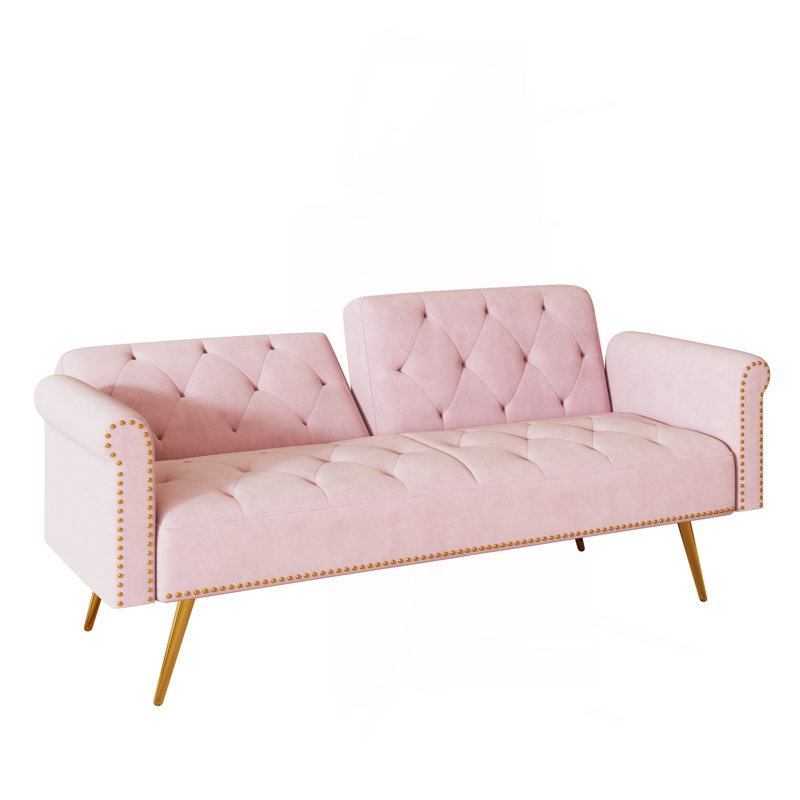 A 69.7-Inch-Long Sofa Bed Covered In Pink Velvet Fabric, Featuring Nail Head Trim And Accompanied By A Matching Throw Pillow