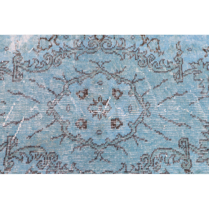 Élégant tapis turc bleu et brun à motif floral idéal pour décorer un salon ou une chambre à coucher