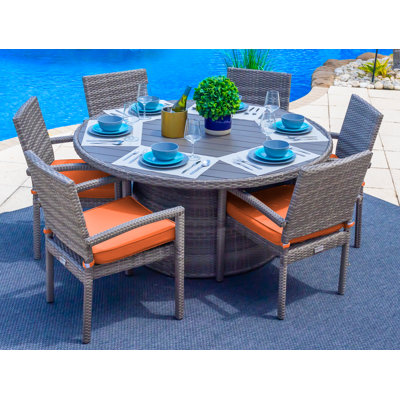 Yussuf 6 - Person Wicker Patio Dining Set with Round Table , Cushions Included