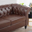 Canapé Chesterfield en polyuréthane à accoudoirs roulés.-114427253