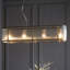 Anesty 4lt Linear Pendant light finished in Ant. Brass