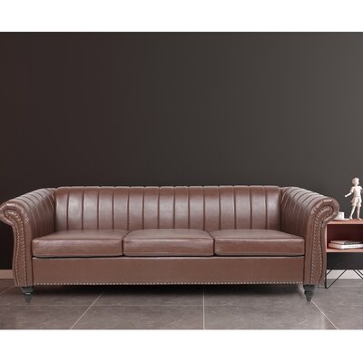 Wilcher 84'' Faux Leather Rolled Arm Chesterfield Sofa with Reversible Cushions -  Alcott Hill®, 0DE7C650C2764C8A82F06BEFF03DA566