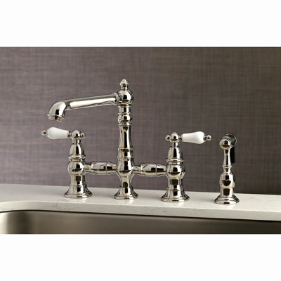 Kingston Brass English Country Two-Handle 4-Hole Deck Mount Bridge Kitchen Faucet with Brass Side Sprayer