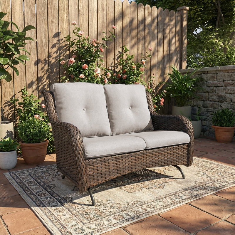 Causeuse de patio berçante Mickala avec structure robuste et sièges coussins, Beige, Brun