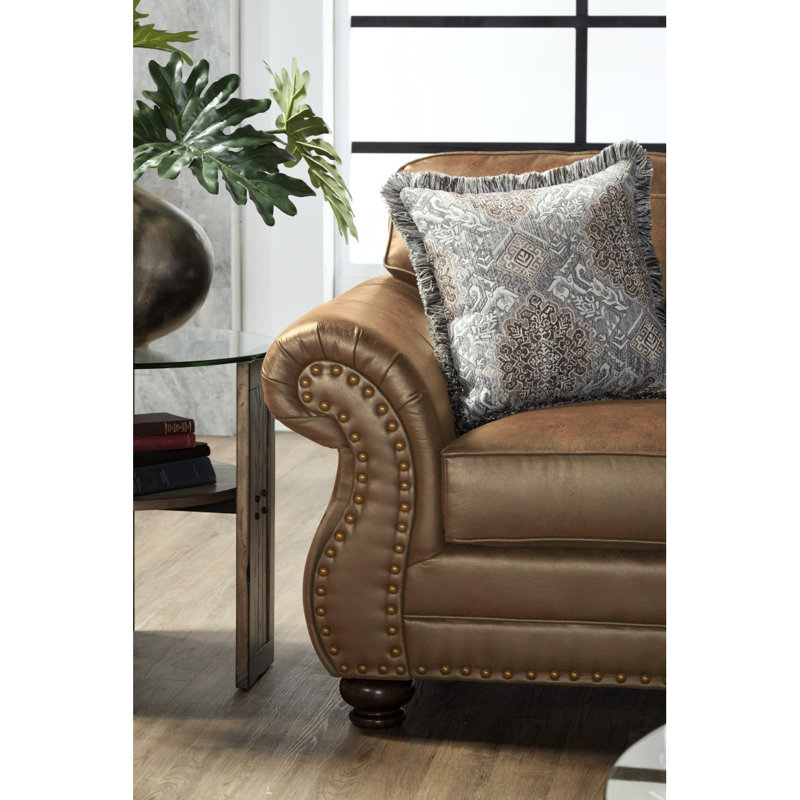 Canapé moderne en similicuir avec têtes de clou bronze antique