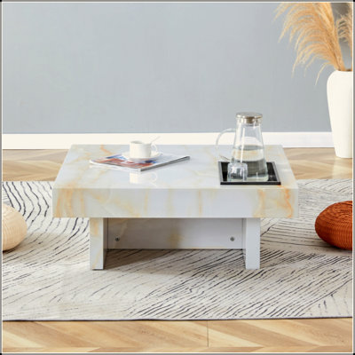 Une table basse moderne et pratique avec des motifs en imitation marbre, fabriquée en panneau de fibres à densité moyenne. La fusion de l'élégance et de la mode naturelle