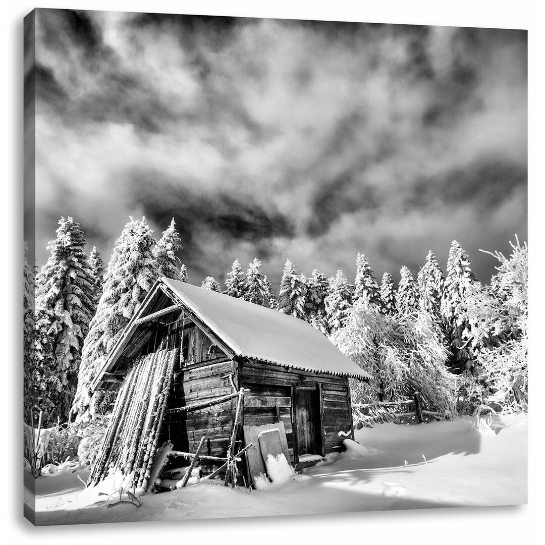 Leinwandbild Holzhütte im Schnee