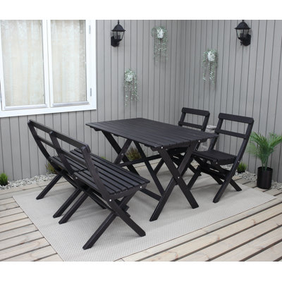 Delia 4 - Person Rectangular Solid Wood Patio Dining Set