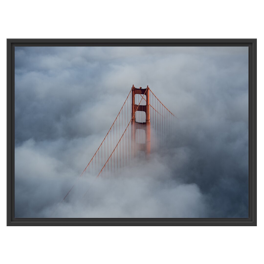 Gerahmtes Wandbild Golden Gate Bridge über den Wolken