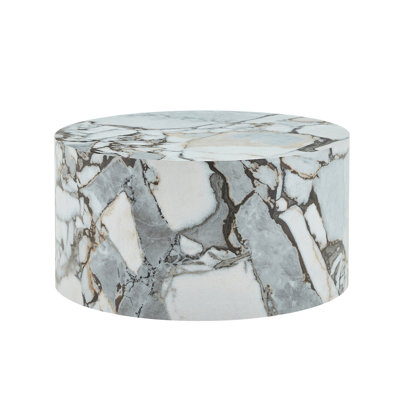 A simple white marble textured cylindrical coffee table