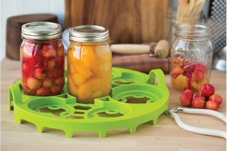 two canning jars with fruit inside