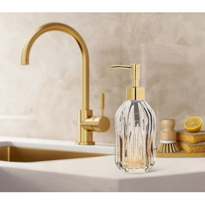 Forme cannelée transparente avec lotion supérieure dorée ou pompe à savon