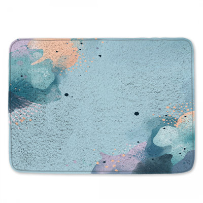 Tapis de bain bleu à motif abstrait