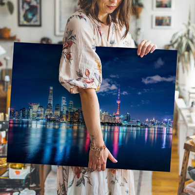 Canvas A Panoramic Nighttime Cityscape Showcasing A Vibrant Skyline Illuminated By Wall Art Countless Lights Reflecting Off The Water Canvas Wall Art