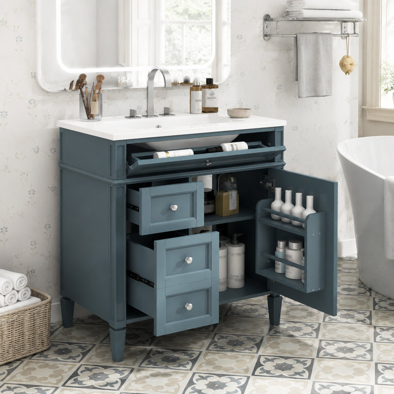 Meuble-lavabo autoportant bleu sarcelle discret avec robinet chromé et lavabo en céramique blanche
