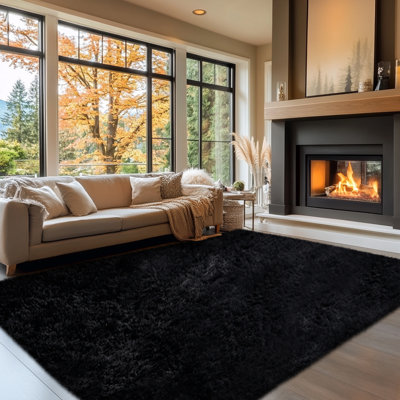 A Soft, Thickened, and Fluffy Black Area Rug Suitable for Both Living Rooms and Bedrooms.