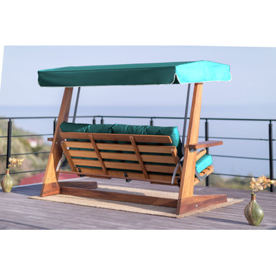 Balancelle triple Premium de couleur chameau uni | Structure 100% bois IROKO, tissu 100% imperméable ETISILK | Dossier réglable à 5 niveaux, facile à nettoyer, résistant aux rayons UV, résistant à la décoloration | Supporte jusqu'à 882 lb, parfai
