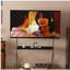 Walk around the TV stand with an antique,black  movable stand for a floor-standing display TV cabinet and projection TV stand