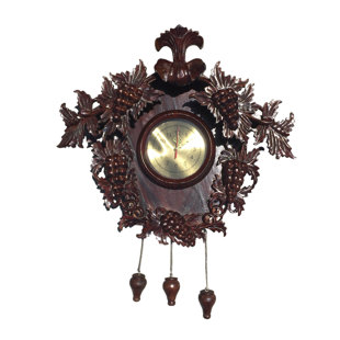 Horloge raisin sculptée